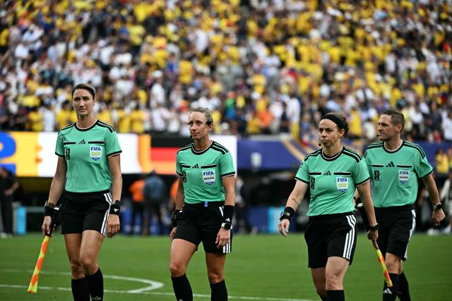 US referee Tori Penso (C) and assistant referees Kathryn Nesbitt (L) and Brooke Mayo (R) walk off the pitch after the 2026 World Cup Group E football match between Ecuador and Germany at the New York/New Jersey Stadium in East Rutherford on June 25, 2026. (Photo by Jewel SAMAD / AFP)