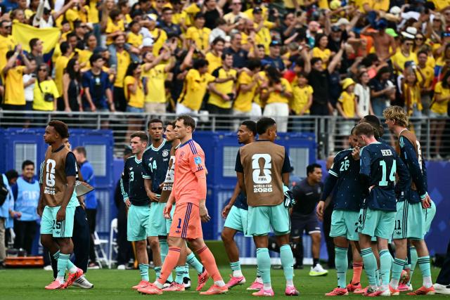 Germany's players react after losing the 2026 World Cup Group E football match between Ecuador and Germany at the New York/New Jersey Stadium in East Rutherford on June 25, 2026. (Photo by Jewel SAMAD / AFP)
