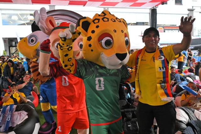 Fans of Ecuador cheer at a Fan Fest in northern Quito, on June 25, 2026 after their team defeated Germany 2-1 and squeezed into the last 32 of the FIFA World Cup. (Photo by Rodrigo BUENDIA / AFP)
