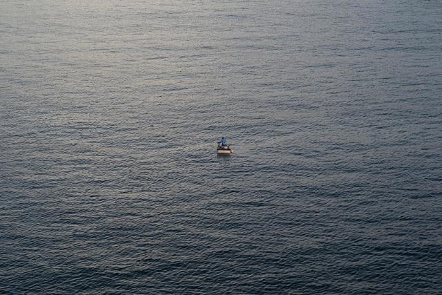 A fisherman rows towards the entrance to Havana Bay near the Morro Lighthouse in Havana on June 24, 2026. (Photo by Pablo PORCIUNCULA / AFP)