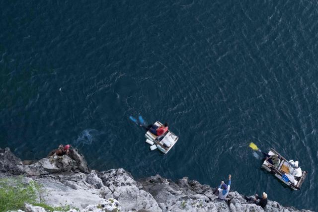 Fishermen row towards the entrance to Havana Bay near the Morro Lighthouse in Havana on June 24, 2026. (Photo by Pablo PORCIUNCULA / AFP)