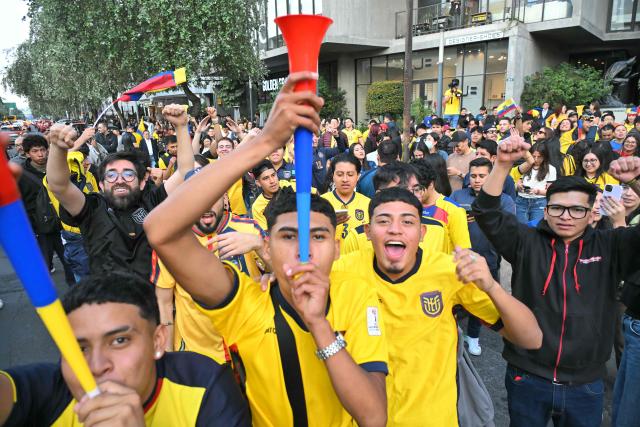 Fans of Ecuador celebrate in the streets of northern Quito on June 25, 2026, after their team defeated Germany 2-1 and advanced to the last 32 of the FIFA World Cup. (Photo by Rodrigo BUENDIA / AFP)