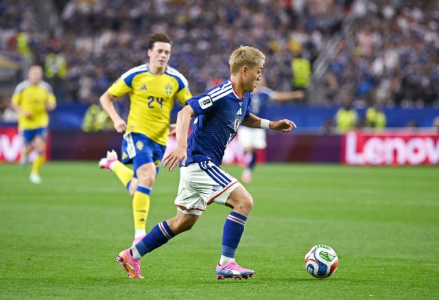 Japan's midfielder #10 Ritsu Doan controls the ball during the 2026 World Cup Group F football match between Japan and Sweden at the Dallas Stadium in Arlington on June 25, 2026.  (Photo by Paul ELLIS / AFP)