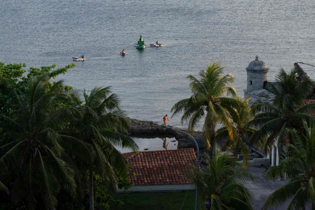 Fishermen row towards the entrance to Havana Bay near the Morro Lighthouse in Havana on June 24, 2026. (Photo by Pablo PORCIUNCULA / AFP)
