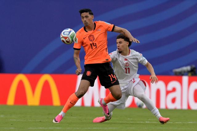 Netherlands' midfielder #14 Tijjani Reijnders and Tunisia's midfielder #11 Ismael Gharbi fight for the ball during the 2026 World Cup Group F football match between Tunisia and the Netherlands at the Kansas City Stadium in Kansas City on June 25, 2026.  (Photo by Juan MABROMATA / AFP)