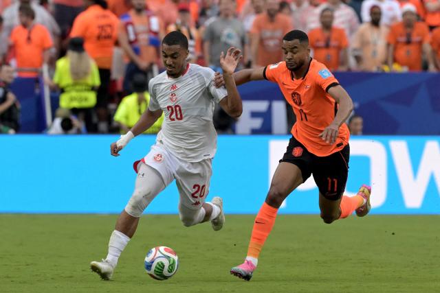 Tunisia's defender #20 Yan Valery and Netherlands' forward #11 Cody Gakpo fight for the ball during the 2026 World Cup Group F football match between Tunisia and the Netherlands at the Kansas City Stadium in Kansas City on June 25, 2026.  (Photo by Juan MABROMATA / AFP)