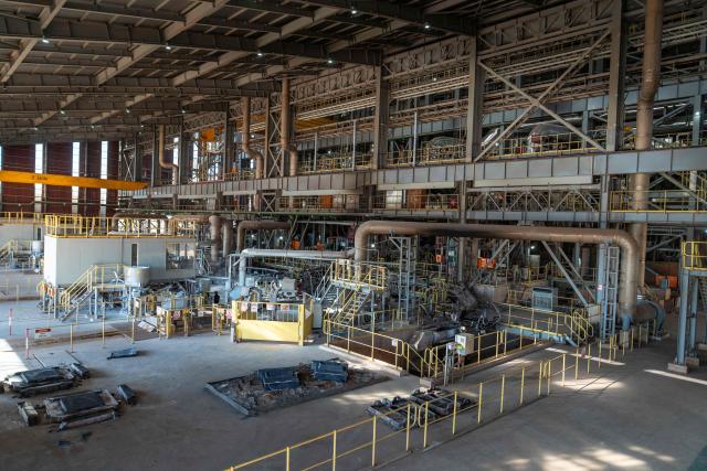 A general view of the copper smelter owned by Kamoa Copper S.A. in Kolwezi, in the southeastern part of the Democratic Republic of the Congo, on May 20, 2026. In vast warehouses at the Kamoa copper mine in the southeastern DR Congo, mountains of reddish rocks pile up as the machines grind away day and night.
As big as a small country, the deposit is one of the Democratic Republic of Congo's hidden treasures -- the centre of a global race for critical minerals.
In the ultra-modern installations, thousands of workers churn out the red gold -- coveted by international markets for its exceptionally high copper content.
China has long been mining it and now, too, the United States is vying for a share, seeking to challenge Beijing's hold on the strategic minerals used to make cars, phones and weapons. (Photo by Glody MURHABAZI / AFP)