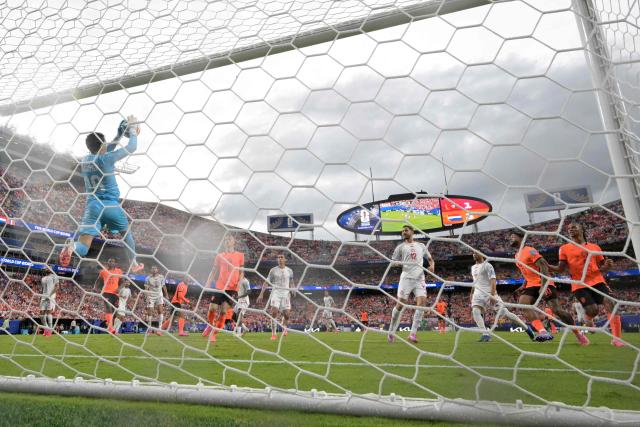 Tunisia's goalkeeper #16 Aymen Dahmen (L) controls the ball during the 2026 World Cup Group F football match between Tunisia and the Netherlands at the Kansas City Stadium in Kansas City on June 25, 2026.  (Photo by Juan MABROMATA / AFP)
