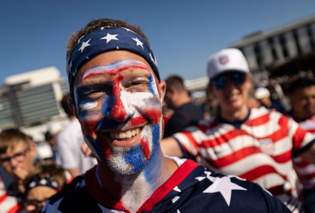 A US fan cheers for his team ahead of the 2026 World Cup Group D football match between Turkey and USA at the Los Angeles Stadium in Inglewood on June 25, 2026.  (Photo by Etienne LAURENT / AFP)