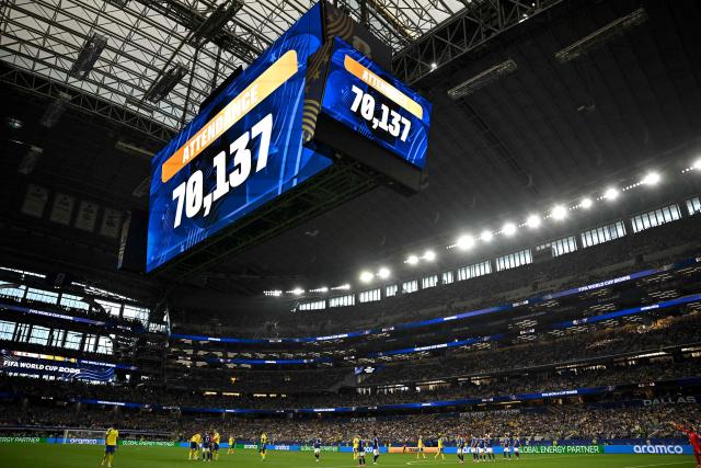 A jumbotron shows the attendance numbers during the 2026 World Cup Group F football match between Japan and Sweden at the Dallas Stadium in Arlington on June 25, 2026.  (Photo by Paul ELLIS / AFP)