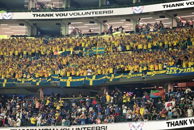 Sweden fans celebrate at the end of the 2026 World Cup Group F football match between Japan and Sweden at the Dallas Stadium in Arlington on June 25, 2026.  (Photo by Paul ELLIS / AFP)