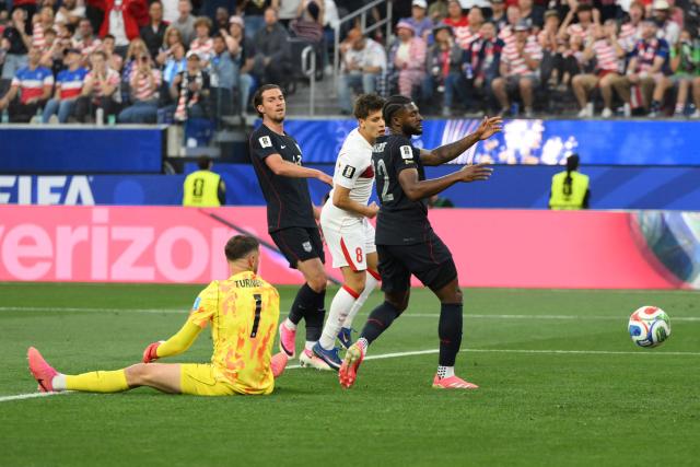 Turkey's midfielder #08 Arda Guler (C) celebrates after scoring his team’s first goal during the 2026 World Cup Group D football match between Turkey and USA at the Los Angeles Stadium in Inglewood on June 25, 2026.  (Photo by Patrick T. FALLON / AFP)