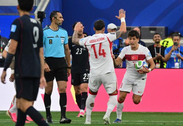 US midfielder #08 Weston McKennie (R) celebrates after scoring his team’s first goal during the 2026 World Cup Group D football match between Turkey and USA at the Los Angeles Stadium in Inglewood on June 25, 2026.  (Photo by Frederic J. BROWN / AFP)