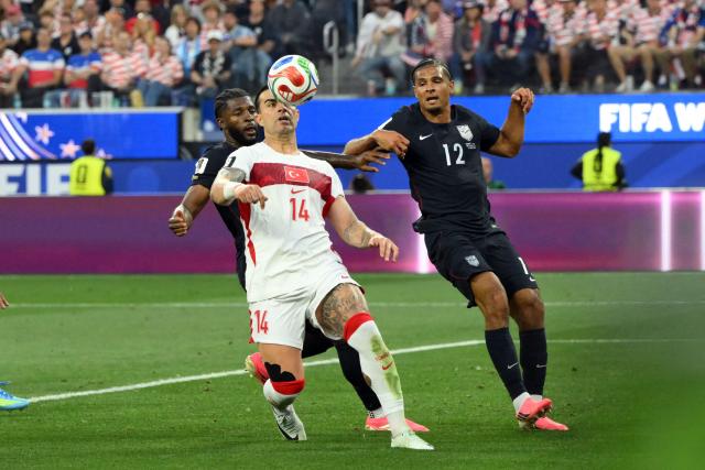 Turkey's defender #14 Abdulkerim Bardakci controls the ball during the 2026 World Cup Group D football match between Turkey and USA at the Los Angeles Stadium in Inglewood on June 25, 2026.  (Photo by Patrick T. FALLON / AFP)