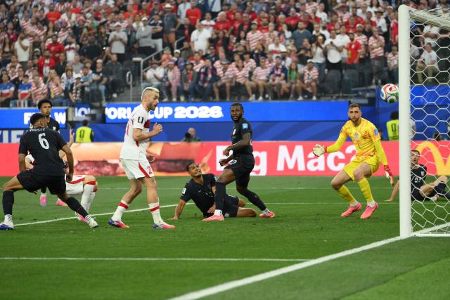 Turkey's forward #21 Baris Alper Yilmaz eyes on the ball during the 2026 World Cup Group D football match between Turkey and USA at the Los Angeles Stadium in Inglewood on June 25, 2026.  (Photo by Patrick T. FALLON / AFP)