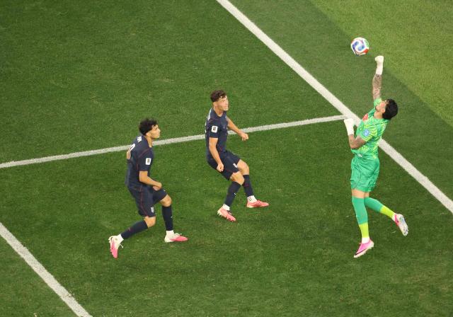 Turkey's goalkeeper #23 Ugurcan Cakir (R) jumps for the ball during the 2026 World Cup Group D football match between Turkey and USA at the Los Angeles Stadium in Inglewood on June 25, 2026.  (Photo by Etienne LAURENT / AFP)