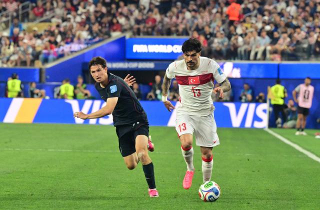 US forward #11 Brenden Aaronson and Turkey's defender #13 Eren Elmali fight for the ball during the 2026 World Cup Group D football match between Turkey and USA at the Los Angeles Stadium in Inglewood on June 25, 2026.  (Photo by Frederic J. Brown / AFP)