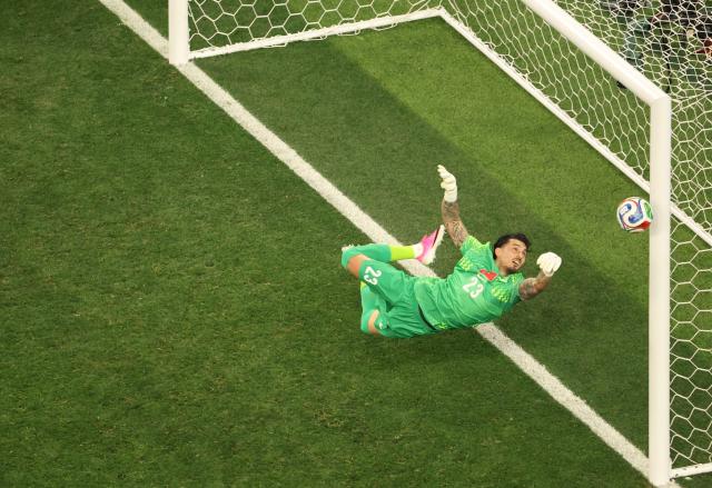 Turkey's goalkeeper #23 Ugurcan Cakir dives for the ball during the 2026 World Cup Group D football match between Turkey and USA at the Los Angeles Stadium in Inglewood on June 25, 2026.  (Photo by Etienne LAURENT / AFP)