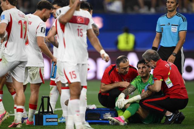 Turkey's goalkeeper #23 Ugurcan Cakir  receives medical attention during the 2026 World Cup Group D football match between Turkey and USA at the Los Angeles Stadium in Inglewood on June 25, 2026.  (Photo by Patrick T. FALLON / AFP)