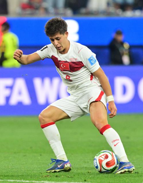 Turkey's midfielder #08 Arda Guler controls the ball during the 2026 World Cup Group D football match between Turkey and USA at the Los Angeles Stadium in Inglewood on June 25, 2026.  (Photo by Frederic J. Brown / AFP)