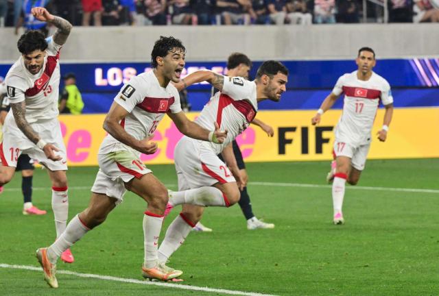 Turkey's defender #22 Kaan Ayhan (R) celebrates after scoring his team’s third goal during the 2026 World Cup Group D football match between Turkey and USA at the Los Angeles Stadium in Inglewood on June 25, 2026.  (Photo by Frederic J. BROWN / AFP)