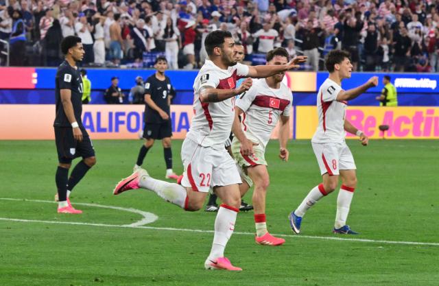 Turkey's defender #22 Kaan Ayhan celebrates after scoring his team’s third goal during the 2026 World Cup Group D football match between Turkey and USA at the Los Angeles Stadium in Inglewood on June 25, 2026.  (Photo by Frederic J. BROWN / AFP)
