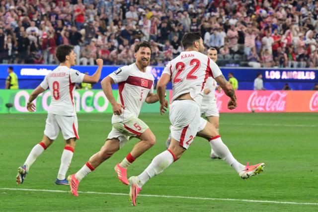 Turkey's defender #22 Kaan Ayhan celebrates after scoring his team’s third goal during the 2026 World Cup Group D football match between Turkey and USA at the Los Angeles Stadium in Inglewood on June 25, 2026.  (Photo by Frederic J. BROWN / AFP)