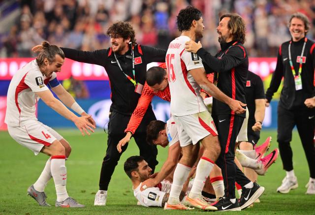 Turkey's defender #22 Kaan Ayhan (C) celebrates after scoring his team’s third goal with teammates during the 2026 World Cup Group D football match between Turkey and USA at the Los Angeles Stadium in Inglewood on June 25, 2026.  (Photo by Frederic J. BROWN / AFP)