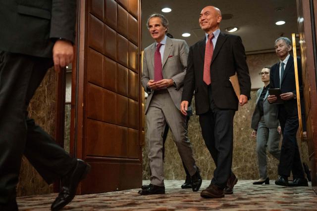 Rafael Mariano Grossi (C), Director General of the International Atomic Energy Agency (IAEA), arrives at a press conference at the Japan National Press Club in Tokyo on June 26, 2026. (Photo by Yuichi YAMAZAKI / AFP)