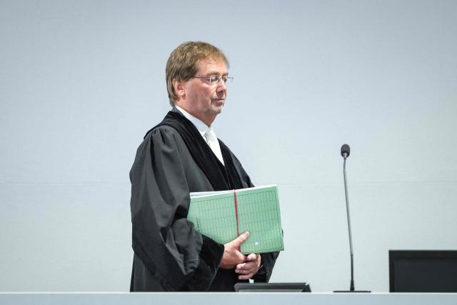 Presiding judge Dirk Sternberg arrives in the temporary courtroom in Magdeburg, eastern Germany on June 26, 2026, before the trial against Saudi Arabian defendant Taleb Jawad al-Abdulmohsen over the deadly Christmas market attack in December 2024. The court sentenced to life in jail the Saudi psychiatrist who drove an SUV through a crowded Christmas market in 2024, killing six people and injuring more than 300. (Photo by Ronny HARTMANN / AFP)