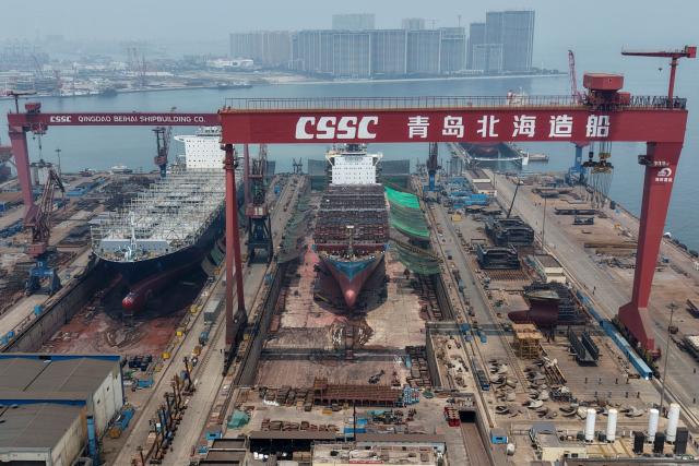 This aerial photo shows the Qingdao Beihai Shipyard in Qingdao, China’s eastern Shandong province on June 25, 2026. (Photo by CN-STR / AFP) / China OUT