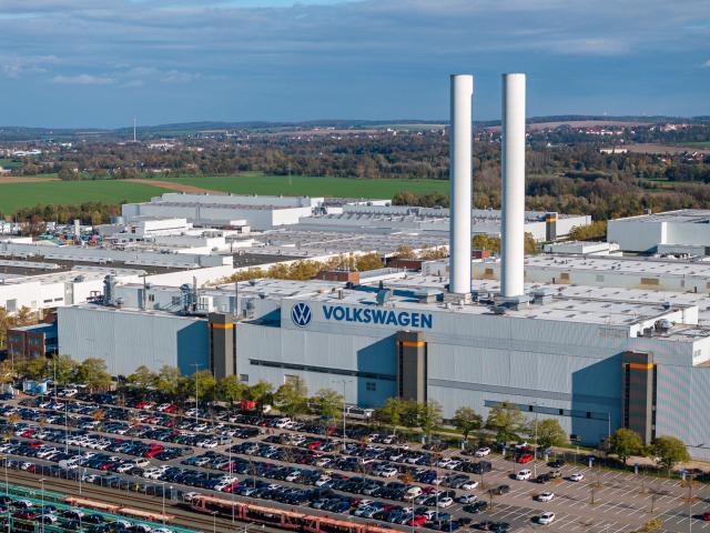 (FILES) Aerial view taken on October 28, 2024 shows the plant of German car maker Volkswagen (VW) in Zwickau, eastern Germany. According to a media report on June 26, 2026, the car manufacturer Volkswagen plans to cut up to 100,000 jobs. Four plants in Germany are to be closed, the "Manager Magazin" reported, citing insiders. In addition, VW CEO Oliver Blume is reportedly planning to spin off the core Volkswagen brand into a new company. According to the report, the job cuts are planned worldwide. (Photo by AFP)