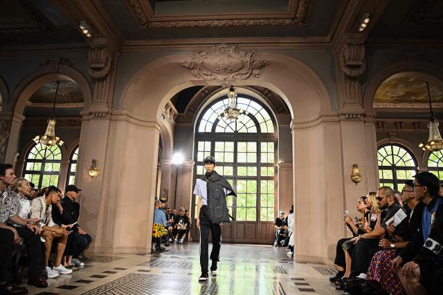 A model presents a creation by Junya Watanabe for the Menswear Spring/Summer 2027 collection fashion show as part of the Paris Fashion Week, in Paris on June 26, 2026. (Photo by JULIEN DE ROSA / AFP)
