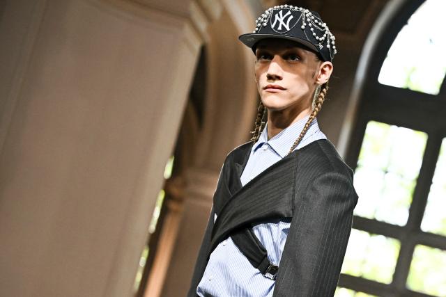 A model presents a creation by Junya Watanabe for the Menswear Spring/Summer 2027 collection fashion show as part of the Paris Fashion Week, in Paris on June 26, 2026. (Photo by JULIEN DE ROSA / AFP)
