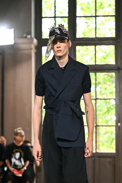 A model presents a creation by Junya Watanabe for the Menswear Spring/Summer 2027 collection fashion show as part of the Paris Fashion Week, in Paris on June 26, 2026. (Photo by JULIEN DE ROSA / AFP)