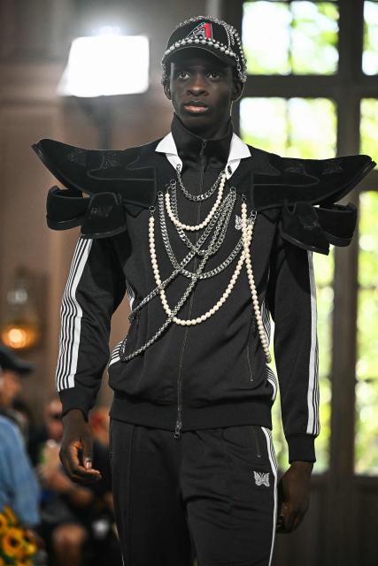 A model presents a creation by Junya Watanabe for the Menswear Spring/Summer 2027 collection fashion show as part of the Paris Fashion Week, in Paris on June 26, 2026. (Photo by JULIEN DE ROSA / AFP)