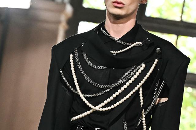 A model presents a creation by Junya Watanabe for the Menswear Spring/Summer 2027 collection fashion show as part of the Paris Fashion Week, in Paris on June 26, 2026. (Photo by JULIEN DE ROSA / AFP)