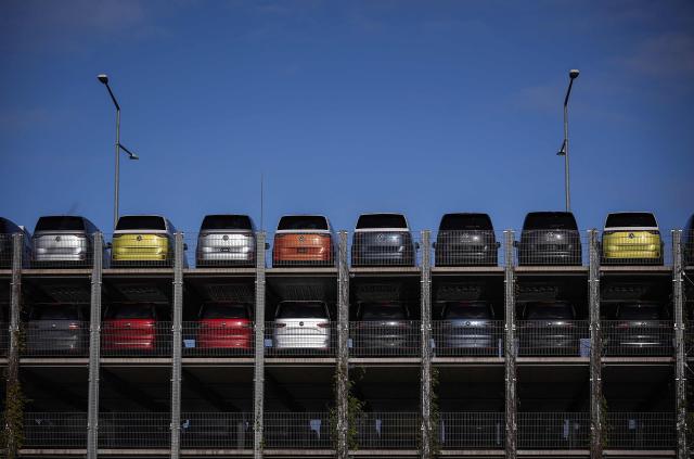 (FILES) New VW ID Buzz vehicles, fully electric-driven microbus cars from Volkswagen Commercial Vehicles, are seen parked before delivery at the commercial vehicle plant of German car manufacturer Volkswagen (VW) in Hanover, northern Germany, on December 20, 2024. According to a media report on June 26, 2026, the car manufacturer Volkswagen plans to cut up to 100,000 jobs. Four plants in Germany are to be closed, the "Manager Magazin" reported, citing insiders. In addition, VW CEO Oliver Blume is reportedly planning to spin off the core Volkswagen brand into a new company. According to the report, the job cuts are planned worldwide. (Photo by Ronny HARTMANN / AFP)