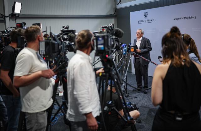 Press spokesperson for the Regional Court of Magdeburg Christian Loeffler gives a press statement in the temporary courtroom in Magdeburg, eastern Germany on June 26, 2026, during the trial against Saudi Arabian defendant Taleb Jawad al-Abdulmohsen over the deadly Christmas market attack in December 2024. The court sentenced to life in jail the Saudi psychiatrist who drove an SUV through a crowded Christmas market in 2024, killing six people and injuring more than 300. (Photo by Ronny HARTMANN / AFP)