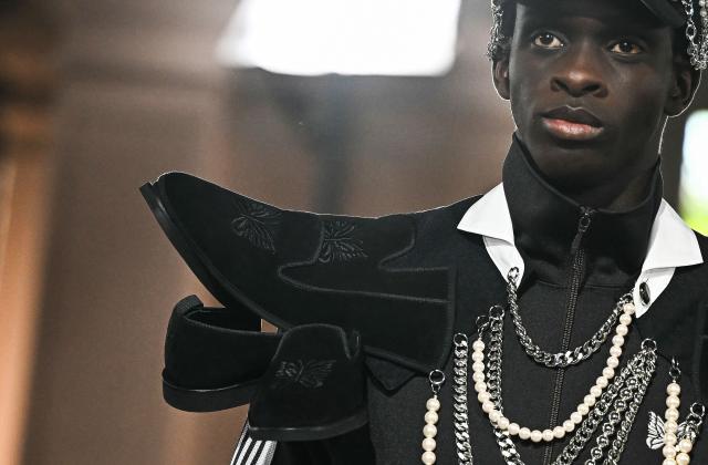 A model presents a creation by Junya Watanabe for the Menswear Spring/Summer 2027 collection fashion show as part of the Paris Fashion Week, in Paris on June 26, 2026. (Photo by JULIEN DE ROSA / AFP)