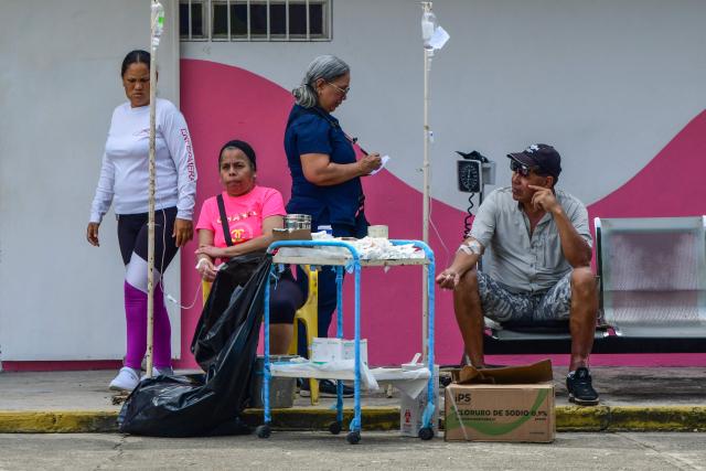 People are treated at a care center following twin earthquakes in Moron, Carabobo State on June 26, 2026. Rescuers used heavy machinery and their bare hands on June 26 in a race to save survivors of deadly twin earthquakes in Venezuela that killed at least 235 people, hurt thousands and flattened scores of buildings. (Photo by Orlando Obispo / AFP)