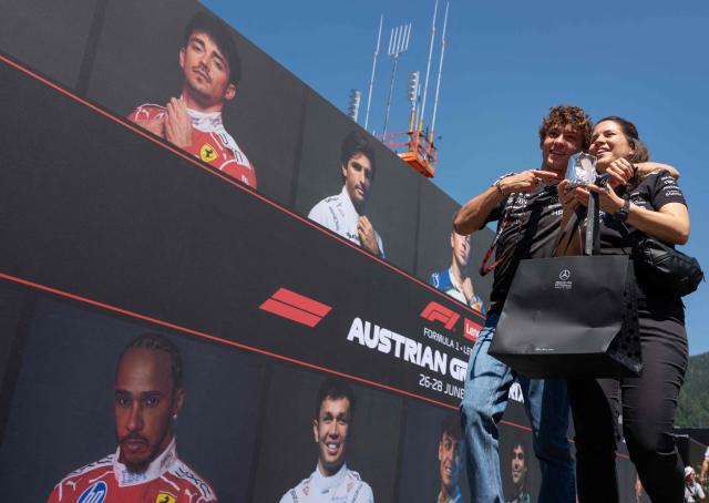 Mercedes' Italian driver Kimi Antonelli and a team member arrive to the paddock prior to the first practice session at the Red Bull Ring race track in Spielberg, Austria on June 26, 2026, ahead of the Formula One Austrian Grand Prix. (Photo by Joe KLAMAR / AFP)