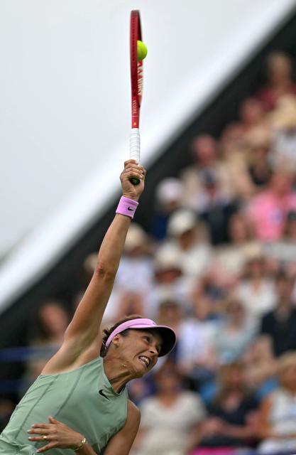 Germany's Tatjana Maria serves against Latvia's Jelena Ostapenko during their women's semi-final tennis match on day five of the Lexus Eastbourne Open at Devonshire Park, Eastbourne, on the south coast of England on June 26, 2026. (Photo by Glyn KIRK / AFP)
