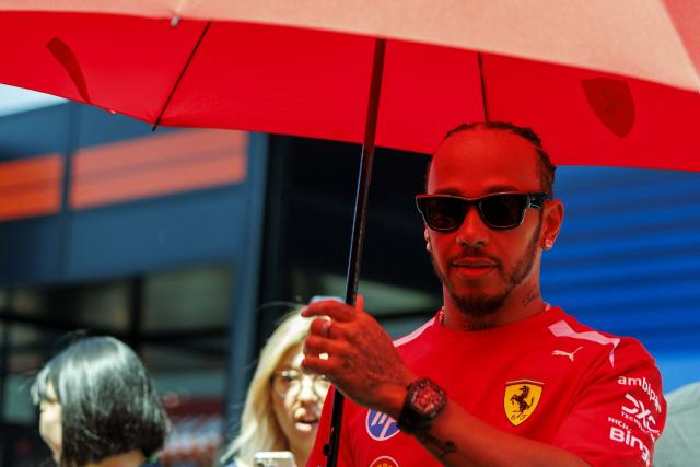 Ferrari's British driver Lewis Hamilton arrives for the first practice session at the Red Bull Ring race track in Spielberg, Austria on June 26, 2026, ahead of the Formula One Austrian Grand Prix. (Photo by ERWIN SCHERIAU / APA / AFP) / Austria OUT