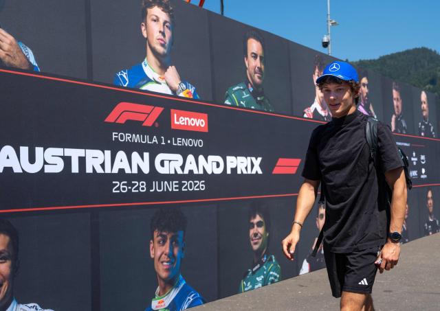 Mercedes' Italian driver Kimi Antonelli walks past a wall with portraits of current F1 drivers as he arrives to the paddock prior to the first practice session at the Red Bull Ring race track in Spielberg, Austria on June 26, 2026, ahead of the Formula One Austrian Grand Prix. (Photo by Joe KLAMAR / AFP)