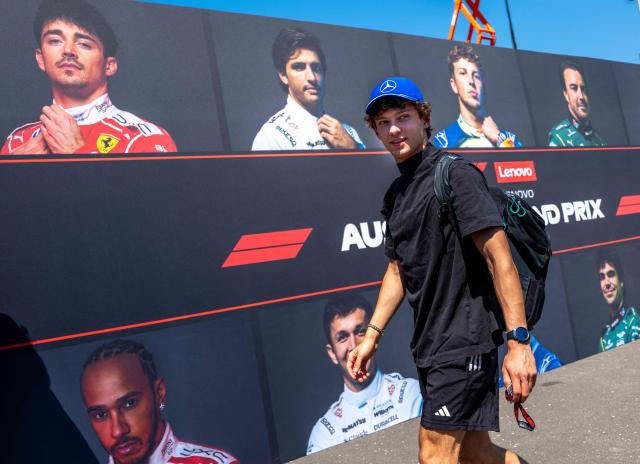 Mercedes' Italian driver Kimi Antonelli walks past a wall with portraits of current F1 drivers as he arrives to the paddock prior to the first practice session at the Red Bull Ring race track in Spielberg, Austria on June 26, 2026, ahead of the Formula One Austrian Grand Prix. (Photo by Joe KLAMAR / AFP)