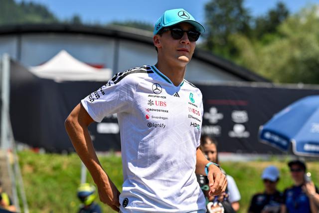 Mercedes' British driver George Russell arrives to the paddock prior to the first practice session at the Red Bull Ring race track in Spielberg, Austria on June 26, 2026, ahead of the Formula One Austrian Grand Prix. (Photo by Andrej ISAKOVIC / AFP)