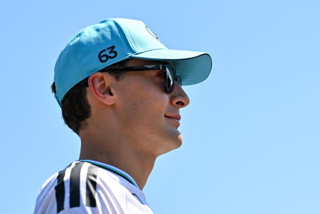 Mercedes' British driver George Russell arrives to the paddock prior to the first practice session at the Red Bull Ring race track in Spielberg, Austria on June 26, 2026, ahead of the Formula One Austrian Grand Prix. (Photo by Andrej ISAKOVIC / AFP)