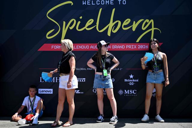 F1 fans wait for drivers to arrive at the paddock prior to the first practice session at the Red Bull Ring race track in Spielberg, Austria on June 26, 2026, ahead of the Formula One Austrian Grand Prix. (Photo by Andrej ISAKOVIC / AFP)
