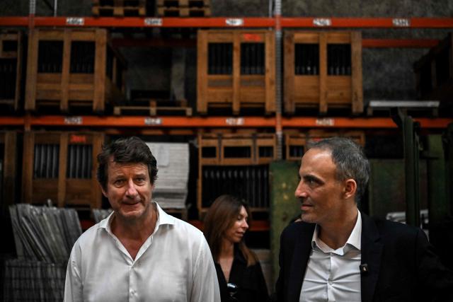 Place publique's centre-left party leader and MEP Raphael Glucksmann (R) and green party Les Ecologists senator Yannick Jadot look on during a visit to the Envie 2E Aquitaine professional insertion company, in Artigues-pres-Bordeaux, outside Bordeaux, southwestern France on June 26, 2026. (Photo by Christophe ARCHAMBAULT / AFP)